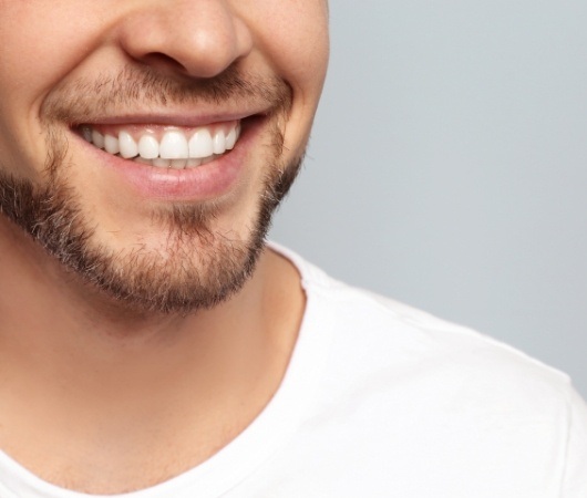 Close up of smiling man with short beard