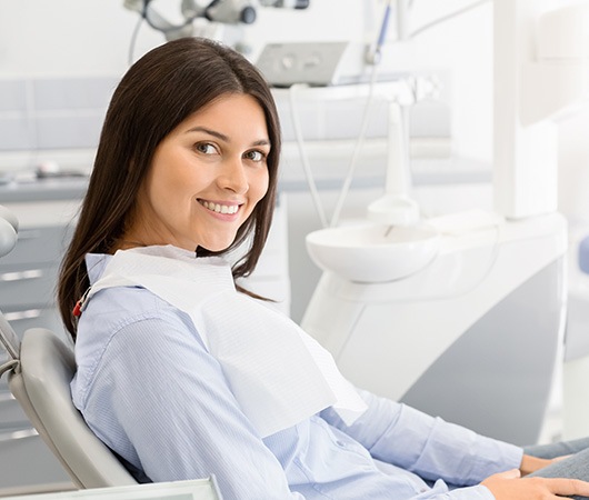 Happy dental patient looking to the side