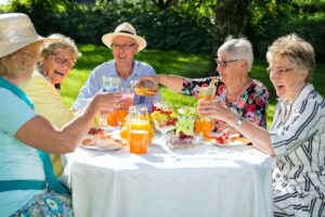 Group of senior friends enjoying a meal together